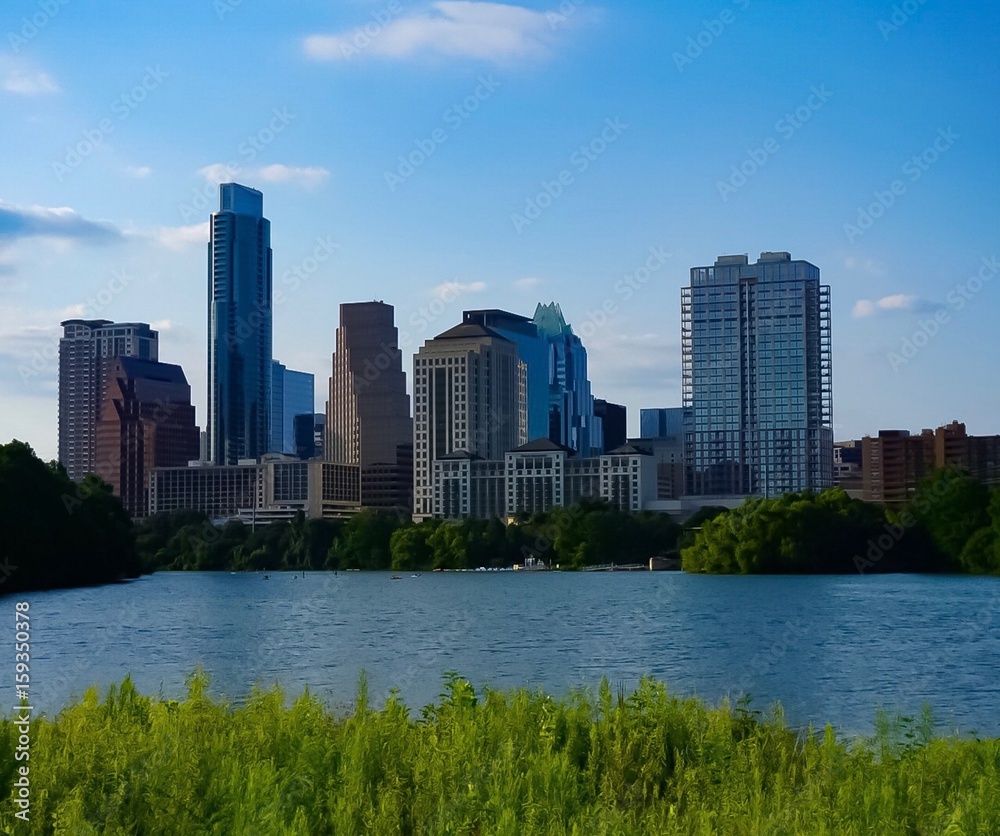 A skyline view of downtown Austin Texas from the boardwalk on Lady Bird Lake
