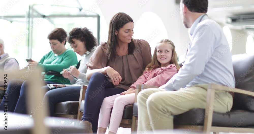 Mother and Child talking with Doctor in waiting room Mother and Child talking with Doctor in waiting room