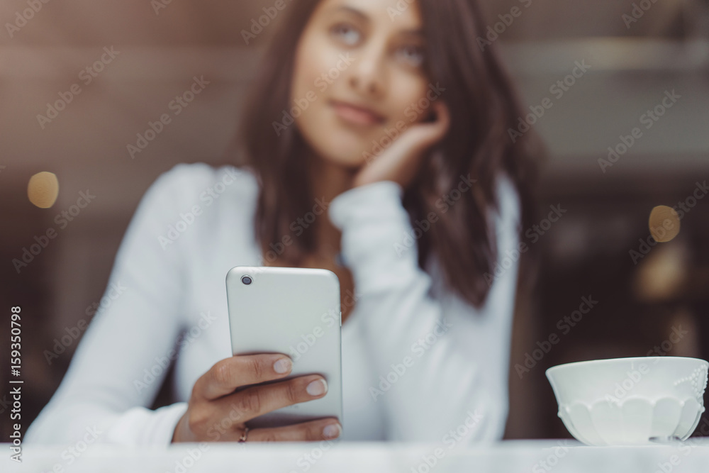 Beautiful woman using smartphone at coffee shop, Beautiful woman using smartphone at coffee shop,