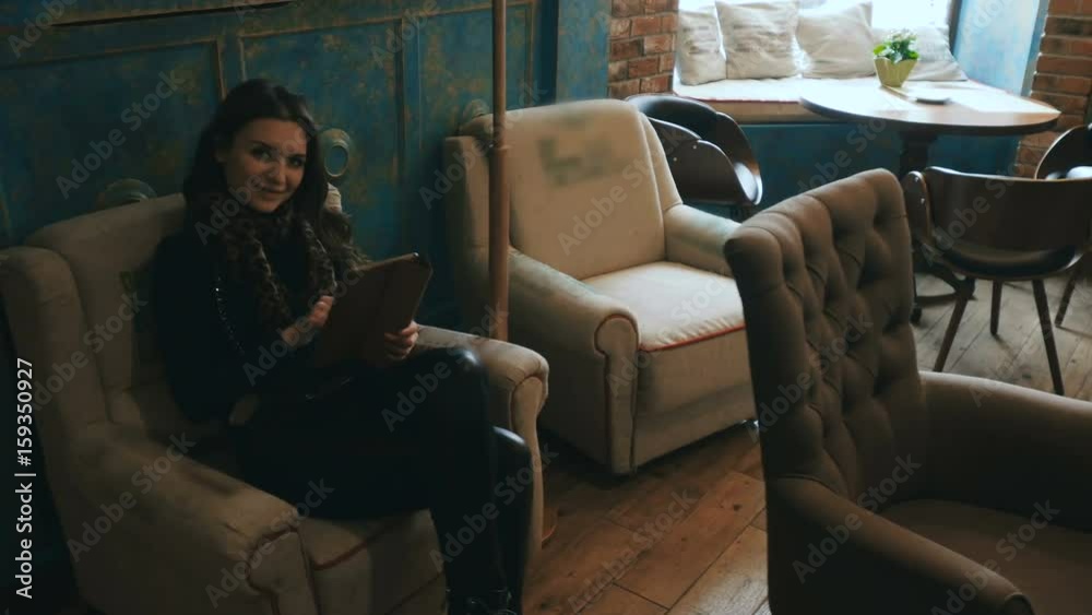 beautiful brunette relax with tablet in cafe beautiful brunette relax with tablet in cafe