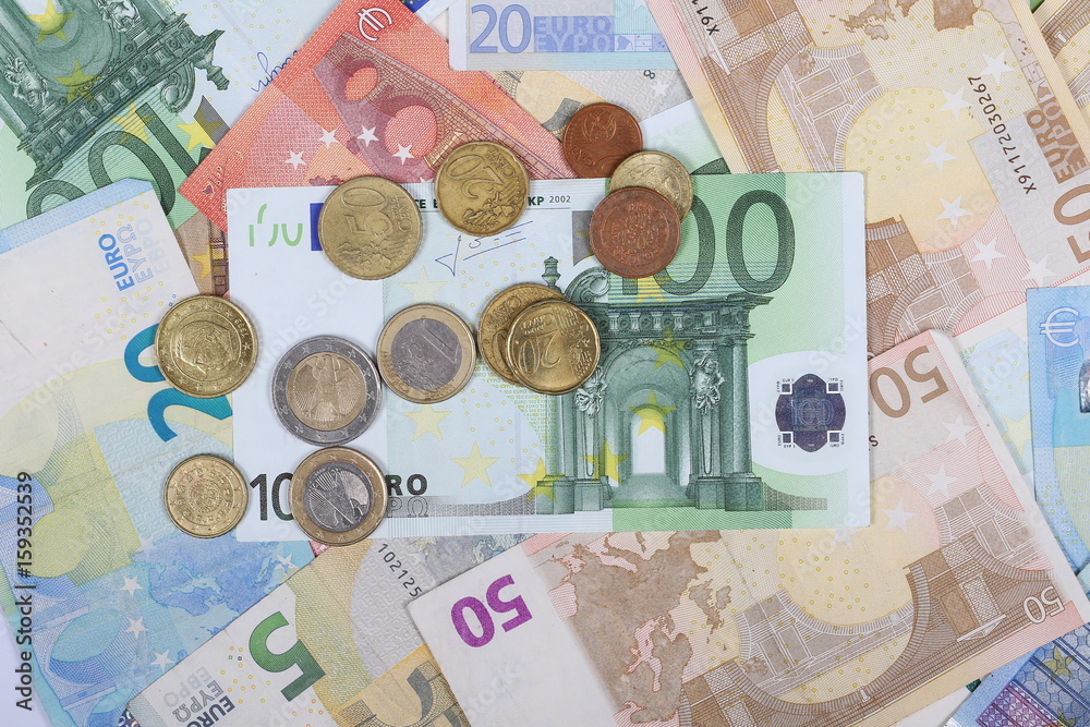 Euro bank notes with metal coins, bills background and texture