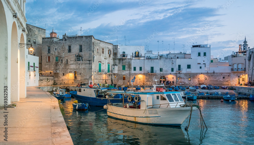 Old harbour in Monopoli at sunset, Bari Province, southern Italy. 