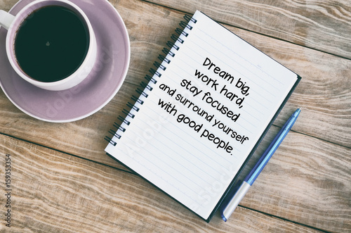 Inspirational quotes text on notepad - Dream big, work hard, stay focused and surround yourself with good people