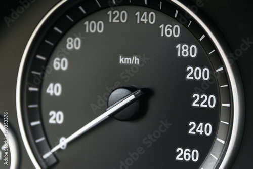 Car instrument panel dashboard closeup with visible speedometer, car interior details