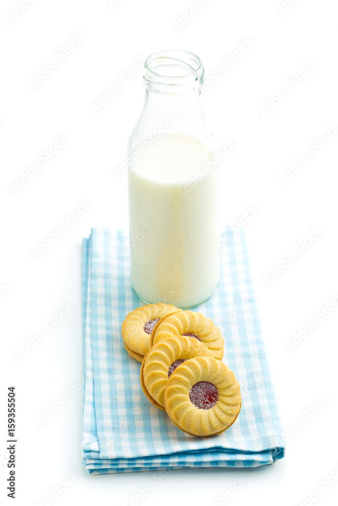 Jam ring biscuits and bottle of milk. Jam ring biscuits and bottle of milk.