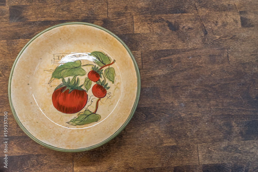 tomato plate on wood surface