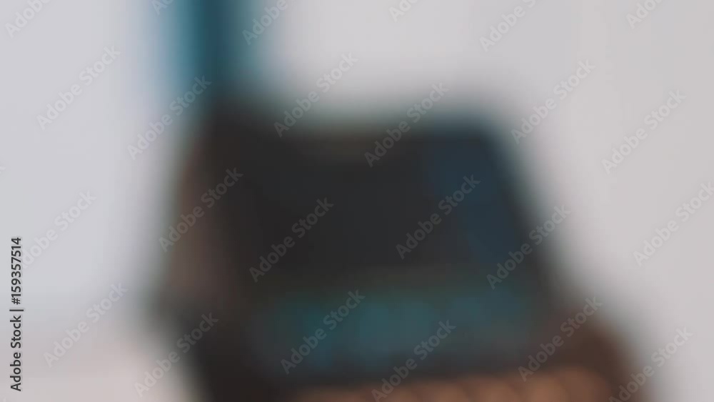 Worker in white rubber gloves cleaning produced magnifier glass with cotton swab against light at facility, close up Worker in white rubber gloves cleaning produced magnifier glass with cotton swab against light at facility, close up