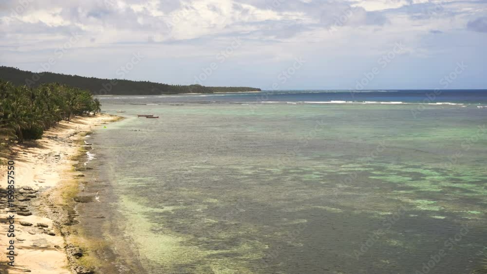 Beautiful tropical island with sand beach, palm trees.Seascape ocean and beautiful beach paradise, Siargao, Philippines. Tropical landscape: beach with palm trees. 4K video Travel concept. Beautiful tropical island with sand beach, palm trees.Seascape ocean and beautiful beach paradise, Siargao, Philippines. Tropical landscape: beach with palm trees. 4K video Travel concept.