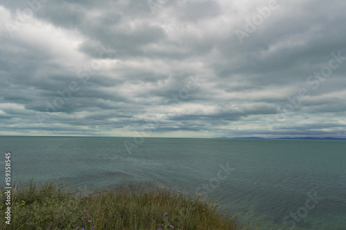 Fototapeta Naklejka Na Ścianę i Meble -  Calm sea with cloudy sky 