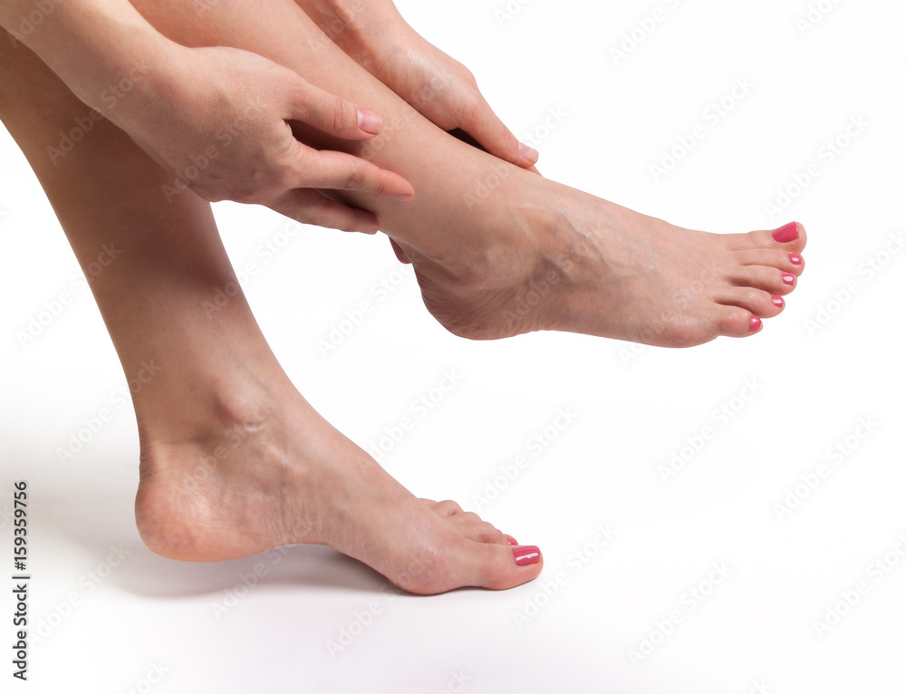 Female slender beautiful legs isolated on white background Female slender beautiful legs isolated on white background