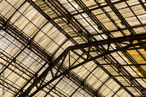 Looking up at a train station roof
