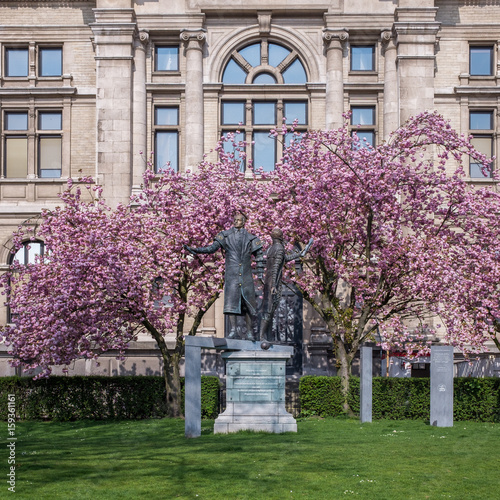 Statues and blossem behind the museum of fine arts in Antwerp, Belgium. photo