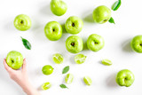 Organic fruits with green apples design on white background top view
