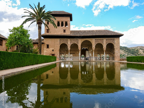 Reflection of the Partal Palace on a pond, Alhambra, Granada photo