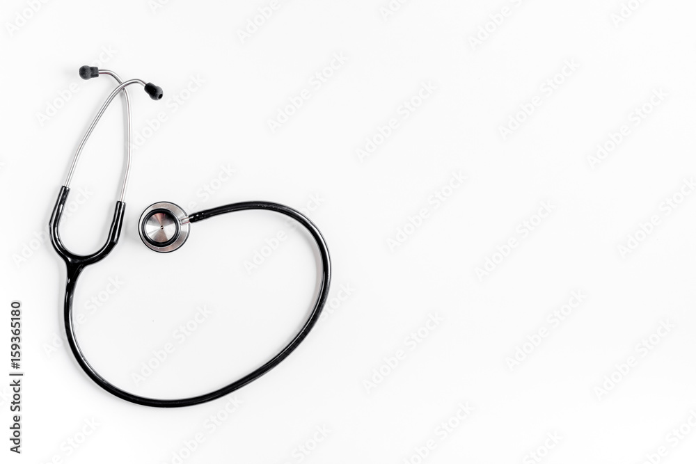 Medical equipment with stethoscope in doctor's office on white desk background top view mock-up Medical equipment with stethoscope in doctor's office on white desk background top view mock-up