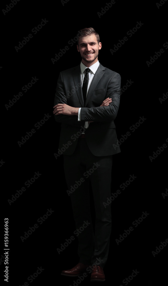 Handsome elegant business man isolated on black