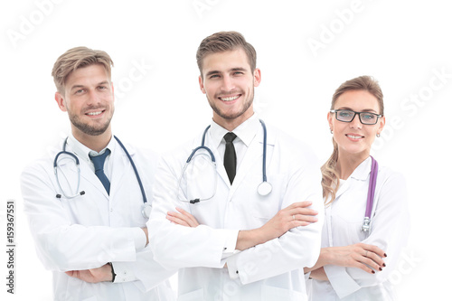 Team of medical professionals looking at camera, smiling.