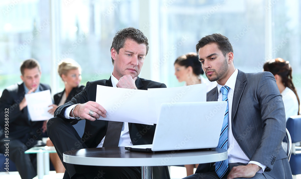 Successful business people  sitting in office and planning work