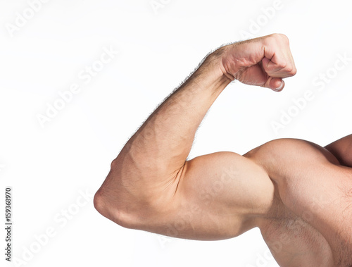 Foto Strong man flexing his arm