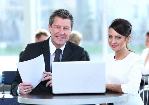 Confident business partners working in office and talking