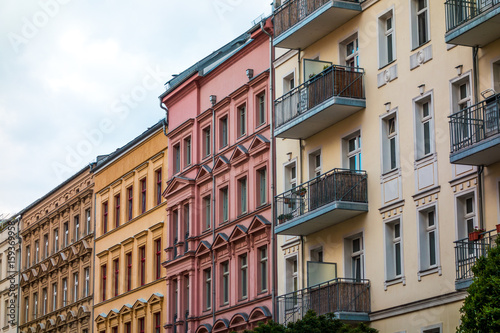 colorful houses at berlin with red, orange, yellow and white facades