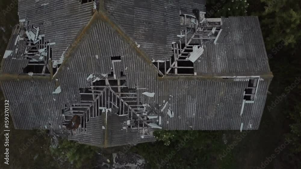 Ruined roof of an old abandoned house. Aerial view