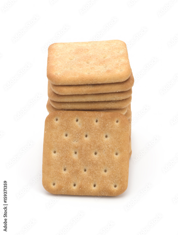 Stack of square crackers isolated on white background. Dry cracker cookies isolated Stack of square crackers isolated on white background. Dry cracker cookies isolated