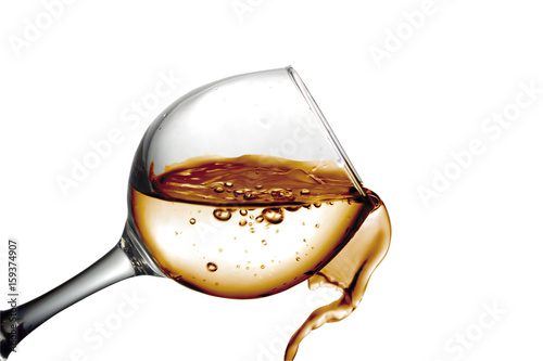 Desert fruit white wine is poured into a glass