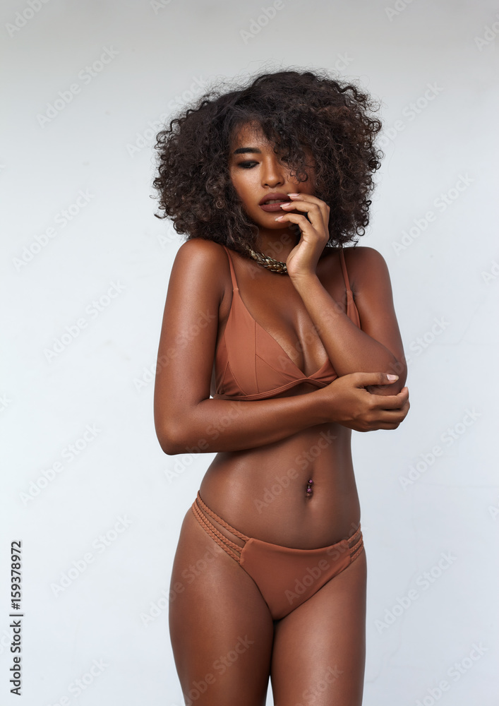 Studio portrait ethnic dark skin female model in bikini - obrazy, fototapety, plakaty 