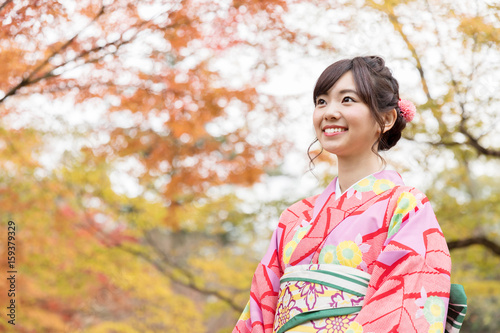 portrait of young asian woman waering kimono in autumn