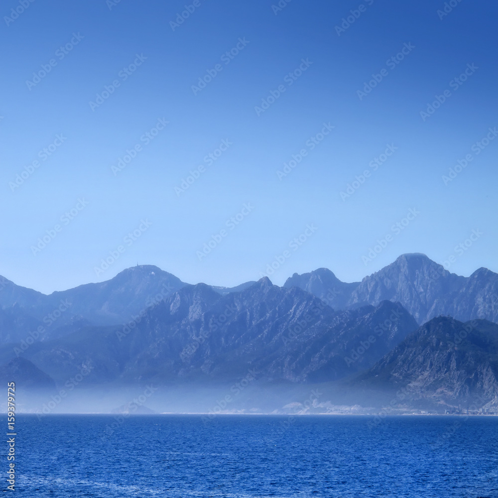 mountains  over clear blue sky.