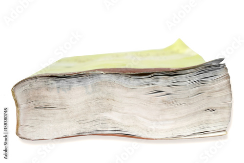 Foto Clousep on the fore edge of a book damaged by water against white background