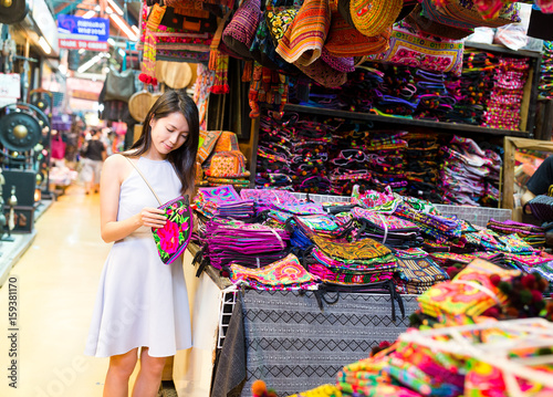 Young Woman shopping in weekend market © leungchopan