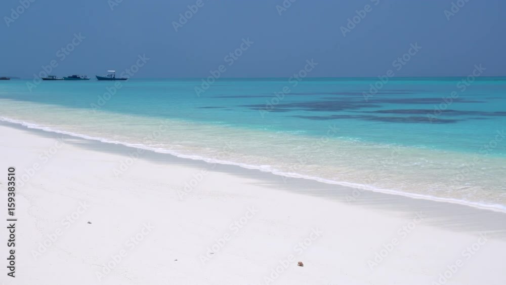 Tropical sandy beach with calm waves on sand bank. Maldivian destination with nobody
Tropical sandy beach with calm waves on sand bank. Maldivian destination with nobody