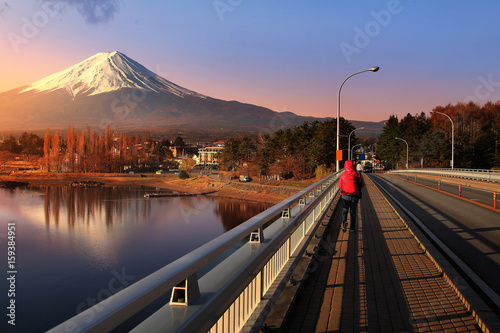 Beautiful scenery during sunrise at Mountain Fuji in kawaguchiko lake and Kawaguchiko Ohashi Bridge of Yamanachi prefecture in Japan. Travel and Attraction Concept