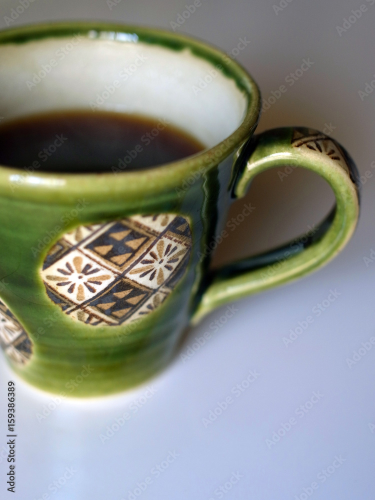 Foto de 織部焼のコーヒーカップ do Stock | Adobe Stock