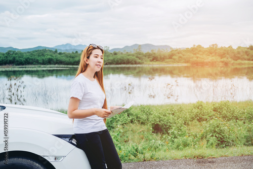 Relaxed happy woman traveler on summer roadtrip vacation on hatchback car © joyfotoliakid