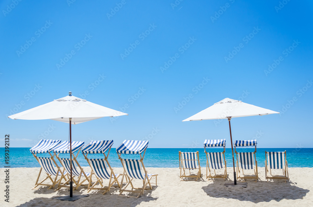 Fototapeta premium Beach chairs near the ocean background