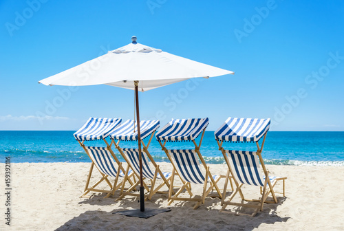 Fototapeta Naklejka Na Ścianę i Meble -  Beach chairs near the ocean background