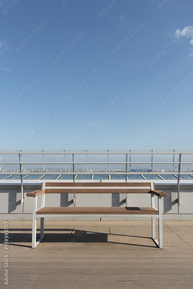 Fototapeta premium empty seat on deck with blue sky background