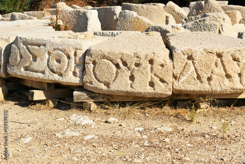 Stone with carved script in ancient Lycian city Patara. Turkey