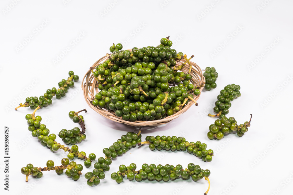 Fresh Peppercorn Berries ,Green pepper seeds in the basket on white background. Fresh Peppercorn Berries ,Green pepper seeds in the basket on white background.