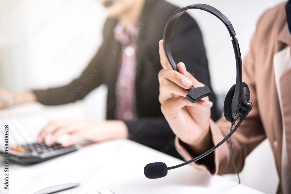 Woman hands holding microphone headset Woman hands holding microphone headset