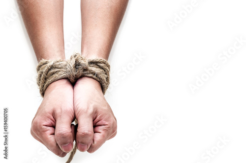 Foto victim, slave, prosoner male hands tied by big rope isolated on the white background