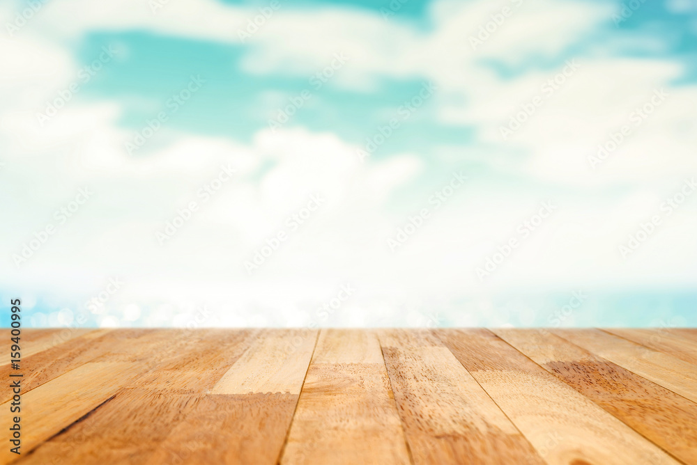 Wood table top on summer blue sea and sky background