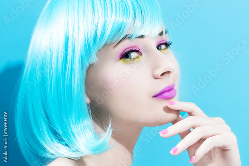 Beautiful woman in a bright blue wig