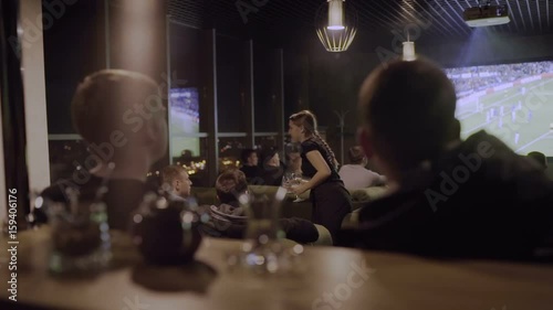 Wallpaper Mural Men watching football on the big screen Torontodigital.ca