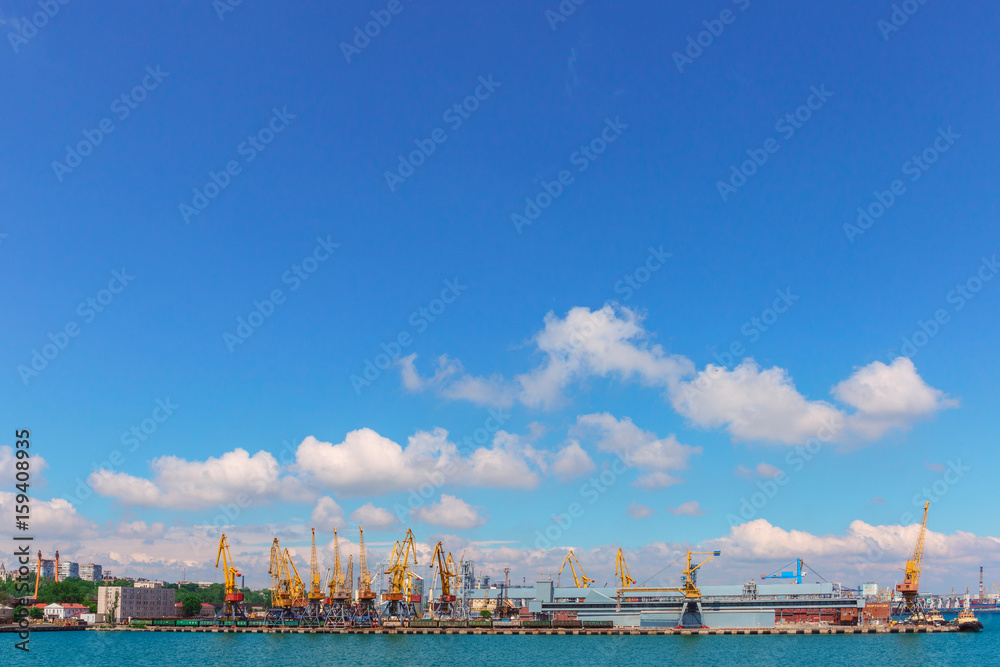 landscape sea port and yellow cranes