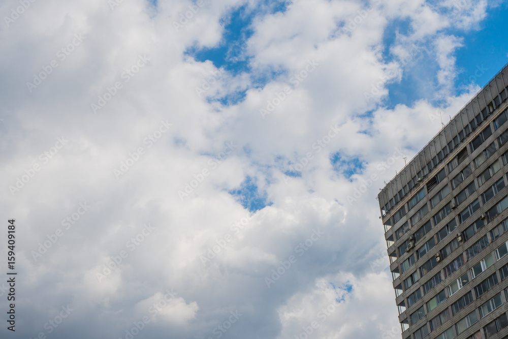 Modern high-rise building made of glass against the sky Modern high-rise building made of glass against the sky