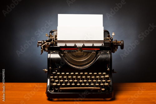 Typewriter With Blank Sheet Of Paper